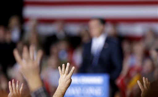 Supporters gesture as they chant "four more days" in reference to the upcoming election as Republican presidential candidate, former Massachusetts Gov. Mitt Romney speaks at a campaign event at Wisconsin Products Pavilion at State Fair Park, Friday, Nov. 2, 2012, in West Allis, Wis. (AP Photo/David Goldman)