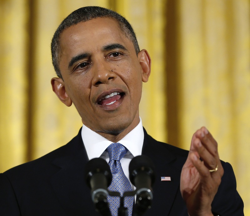 This Nov. 14, 2012 file photo shows President Barack Obama gesturing while answering a question during a news conference in the East Room of the White House in Washington. It's entirely possible that lawmakers and the White House will reach a deal to avert an avalanche of tax increases and deep cuts in government programs before a Jan. 1 deadline. To do so, however, they'll have to resolve serious political and fiscal dilemmas that have stymied them time after time, despite repeated vows to overcome them. (AP Photo/Carolyn Kaster, File)