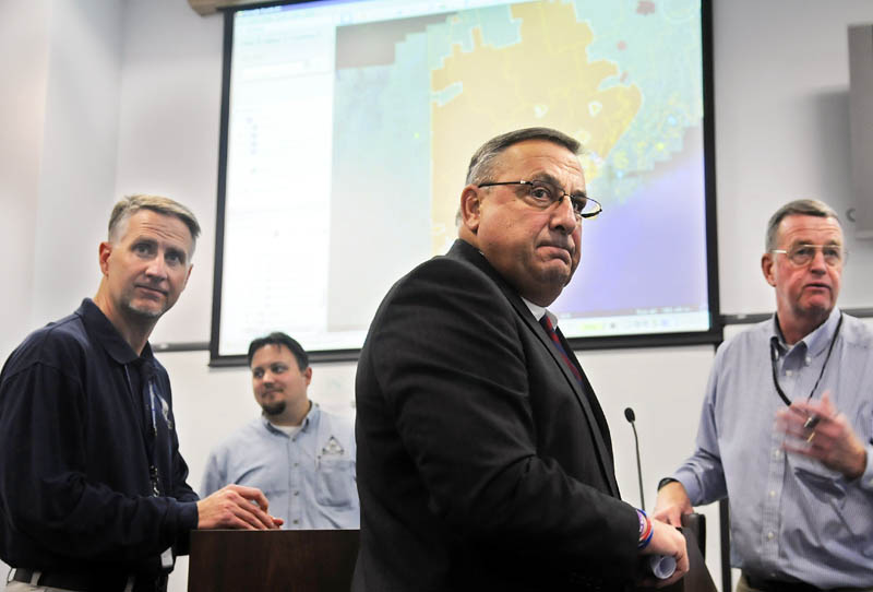 Gov. Paul LePage, center, sent a letter to Health and Human Services Secretary Kathleen Sebelius saying the state would not create a state-run exchange because the health reform law “is a stepping stone to a single-payer system."