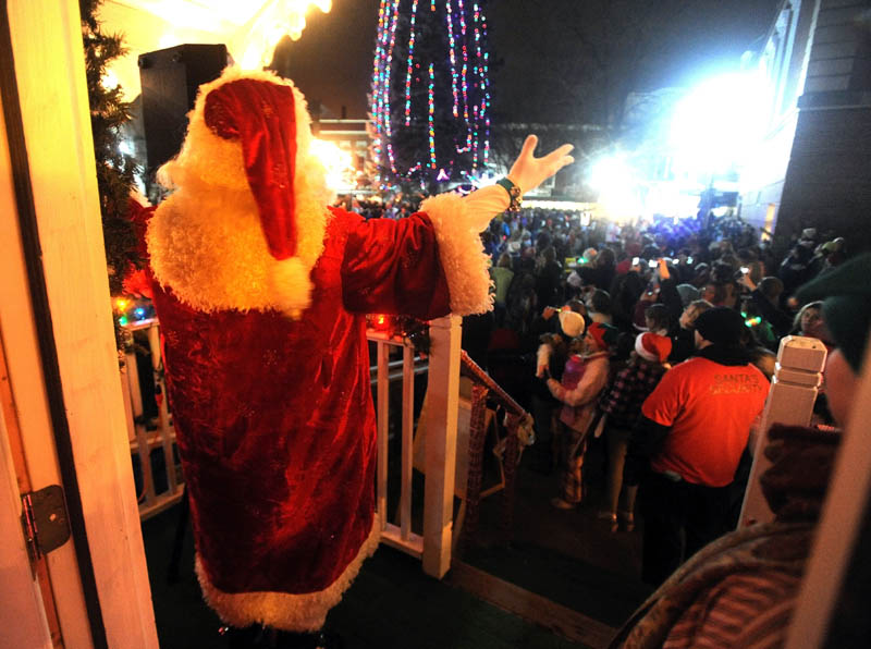 Santa Claus counts down for the annual tree lighting at Kringleville, in Castonguay Square in downtown Waterville, on Friday, after the annual Parade of Lights.