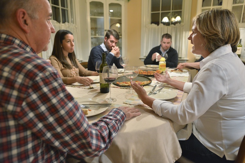 In this photo taken Friday, Nov. 16, 2012, Anne Brennan, right, of Hingham Mass., speaks as, from left, brother-in-law Steve Marshall, of Hingham, niece Rebecca Malone, and her husband Brian Malone, both of Duxbury, Mass., and nephew Andrew Marshall, of Quincy, Mass., are gathered for dinner in Hingham, Mass., where politics are a frequent, and divisive topic of conversation. (AP Photo/Josh Reynolds)