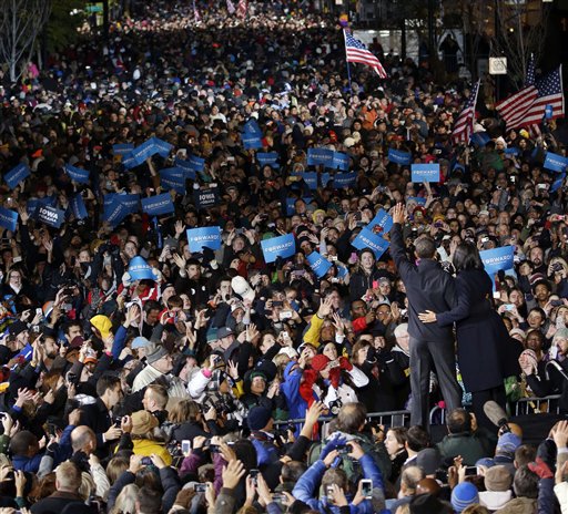 President Barack Obama and first lady Michelle Obama wave to supporter during the final 2012 campaign event in downtown Des Moines, Iowa, Tuesday, Nov. 6, 2012. (AP Photo/Pablo Martinez Monsivais)