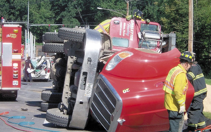 Emergency responders are seen at a fatal crash on Aug. 17, 2011 in Farmington. Charles Willey, 54, of Dexter, was fined $1,500 on Friday, on a civil charge of causing the death of a person while committing a traffic infraction, at Franklin County Superior Court.