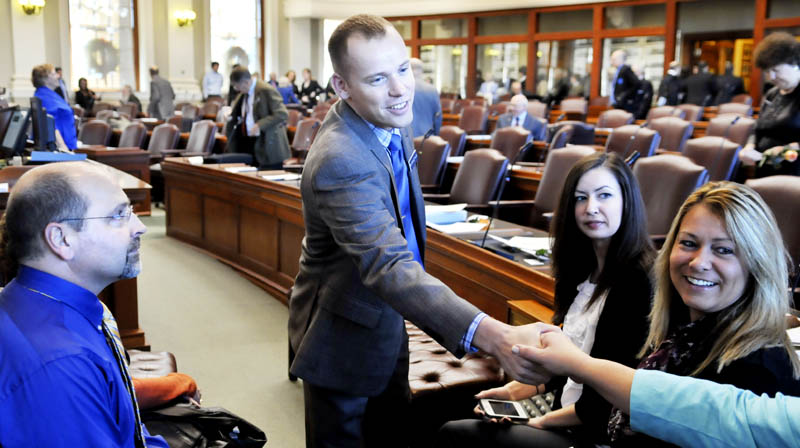 Corey Wilson, R-Augusta, greets well wishers Wednesday, before taking the oath of office in the House of Representatives in Augusta.