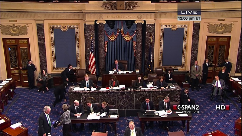 This handout video image provided by CSPAN2 shows former Senate Majority Leader Bob Dole, right, wheeled into the Senate Chamber on Capitol Hill in Washington, Tuesday, Dec. 4,2012, by his wife Elizabeth Dole. Frail and in a wheelchair, Dole was a startling presence on the Senate floor as lawmakers voted on a treaty on disabilities. The 89-year-old Republican was in the well of the Senate on the GOP side of the chamber, his wife Elizabeth nearby. Dole recently had been hospitalized but came to the Senate to push for the treaty. (AP Photo/CSPAN2)