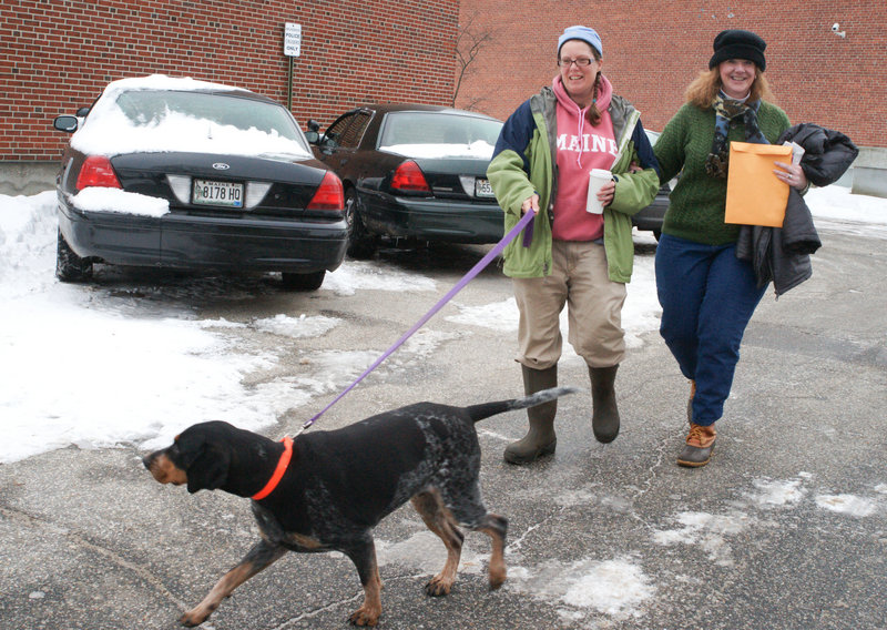 Katherine Wilder, 39, left, and Margaret O’Connell, 44, leave Brunswick Town Hall after getting married. They brought their dog Blue along to the ceremony.