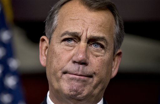 Speaker of the House John Boehner, R-Ohio, speaks to reporters about the fiscal cliff negotiations at the Capitol in Washington on Friday. Hopes for avoiding the "fiscal cliff" that threatens the U.S. economy fell Friday after fighting among congressional Republicans cast doubt on whether any deal reached with President Obama could win approval ahead of automatic tax increases and deep spending cuts Jan. 1.