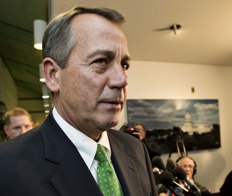 This Jan. 1, 2013 file photo shows House Speaker John Boehner of Ohio walking past reporters after a closed-door meeting meeting of House Republicans on Capitol Hill in Washington. The GOP-controlled House will vote next week to permit the government to borrow more money to meet its obligations, a move aimed at heading off a market-rattling confrontation with President Barack Obama over the so-called debt limit. Full details aren’t settled yet, but the measure would give the government about three more months of borrowing authority beyond a deadline expected to hit as early as mid-February, a Republican official said Friday. (AP Photo/J. Scott Applewhite)