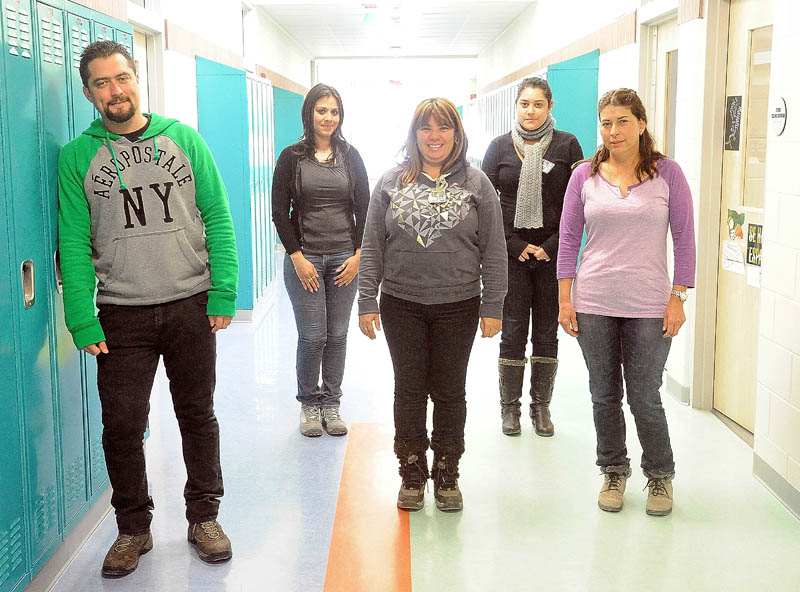 Teachers from Costa Rica toured Mt. Blue High School in Farmington Friday. They are, from left, Douglas Bolanos, 35; Laura Lopez, 31; Zileny Chaves, 45; Adriana Mesen, 22; and Xinia Vega, 50.