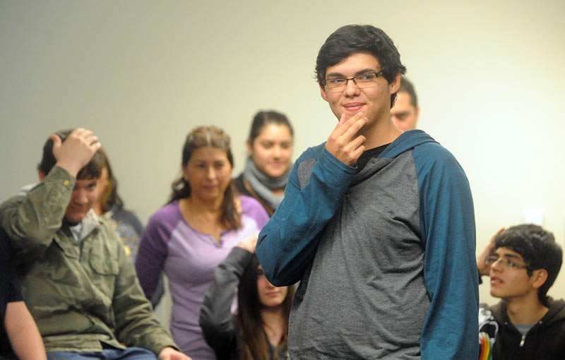 Jean Carlos Campos, 15, of Heredia, Costa Rica, plays a game with students in Spanish class at Mt. Blue High School during a visit in Farmington recently.