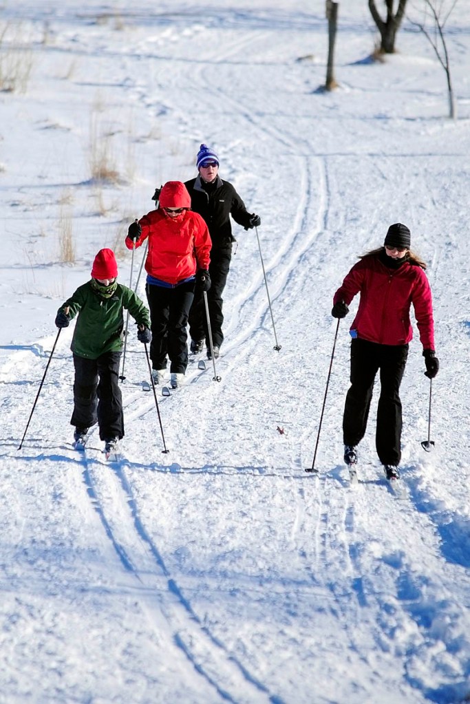 Cross country skiers curve around a bend in the trail on Tuesday at the Viles Arboretum in Augusta. There are several miles of groomed ski trails at the arboretum, which is located at 153 Hospital St.