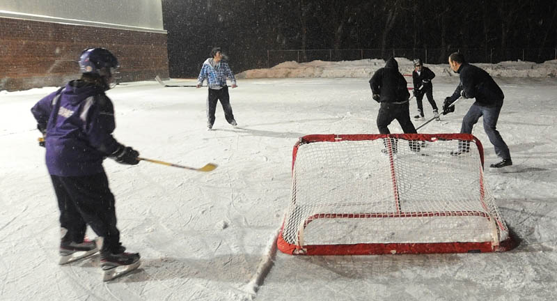 Kids play hockey at the ice rink at the Alfond Youth Center on North Street in Waterville in January.