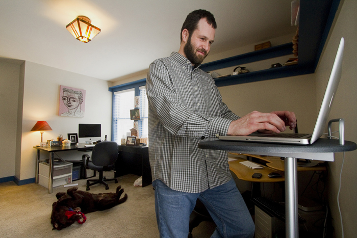 More and more people are telecommuting, working remotely from home, like Mike MacDonald, of Cape Elizabeth, who works in his home office on Friday.