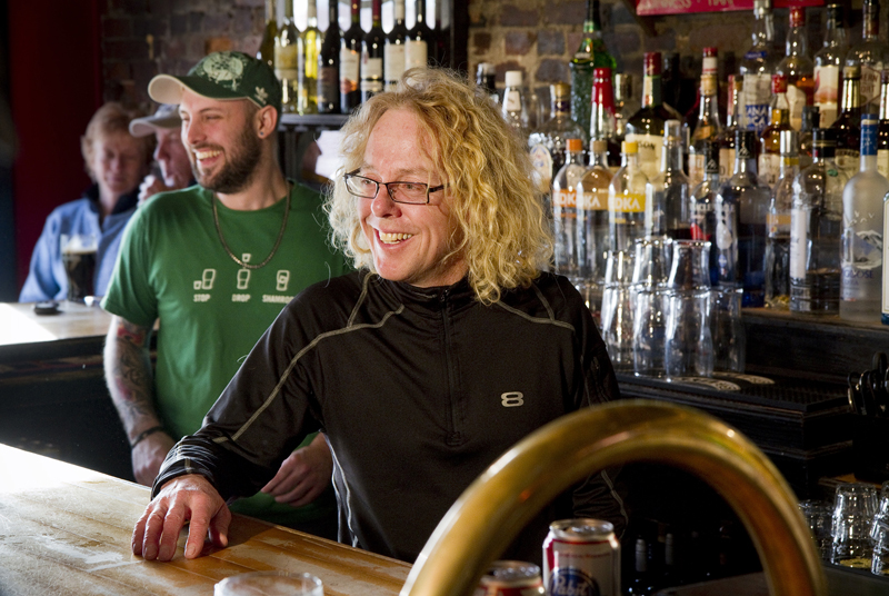 Brian Boru co-owner Daniel Steele, at right, chats with patrons from behind the bar of the Portland Irish Pub on Friday, March 8, 2013.