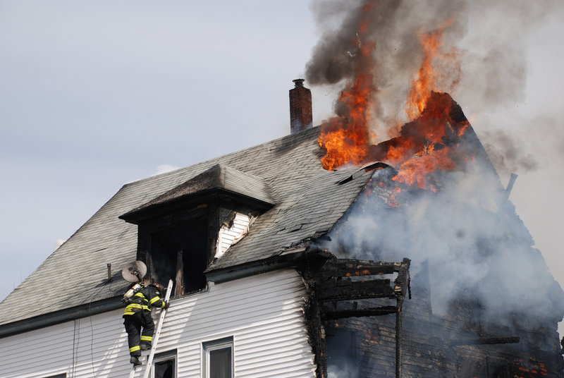 Fire erupts Saturday afternoon from an apartment building at 39 Church St. in Jay, leaving three families homeless.