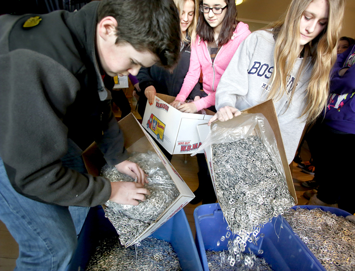 Students from Sheila McAtee's 7th-grade class at Gorham Middle School, deliver 1 million tab tops to the Ronald McDonald House on Friday morning in Portland. Students are, from left: Andrew Harjula, Caitlin Callahan, Katie Baker and Maddie Rossignol.