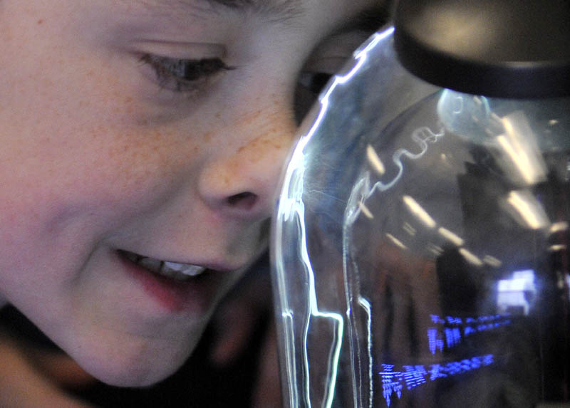 A fifth-grader participates in the first Science, Technology, Engineering and Math Day at Albert S. Hall School in Waterville on Friday.