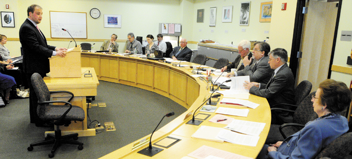 Rep. Matt Pouliot, R-Augusta, introduces L.D. 843 "An Act to Promote the Financial Literacy of High School Students," Friday during a meeting of legislature's education committee in Cross Building in Augusta.