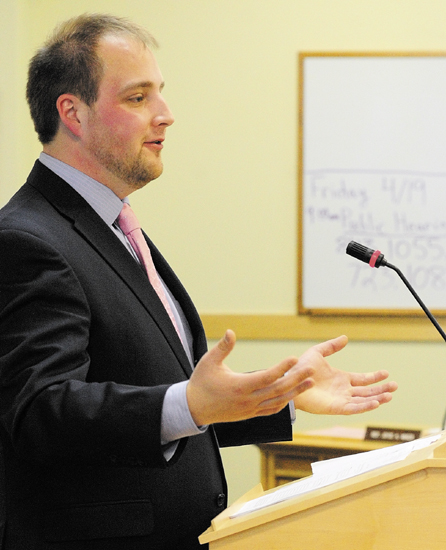 Rep. Matt Pouliot, R-Augusta, introduces L.D. 843 "An Act to Promote the Financial Literacy of High School Students," on Friday during a meeting of legislature's education committee in Cross Building in Augusta.