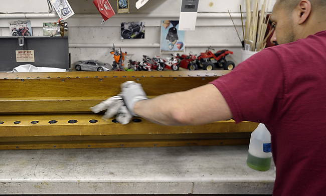 Technician Mee Racz, preps an offset chest for refinishing as he and a crew of technicians work on refurbishing the Kotzschmar Organ from Merrill Auditorium in Portland, Maine at Foley-Baker, Inc. in Toland, Connecticut.