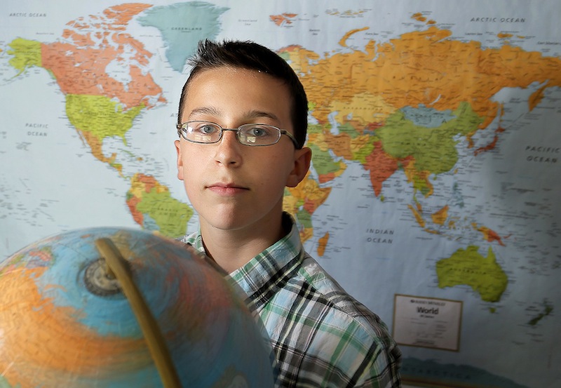 Archer Thomas, 13, an eighth-grader at Bonny Eagle Middle School, poses for a portrait in his Buxton home Friday, May 17, 2013. Thomas competed in the National Geography Bee in Washington, D.C.