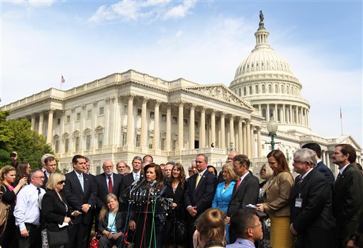 U.S. Rep. Michele Bachmann, R-Minn., chair of the Tea Party Caucus, center, speaks last week during a news conference with Tea Party leaders about the IRS targeting Tea Party groups on Capitol Hill.