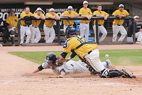 SAFE: University of Southern Maine’s Forrest Chadwick, a Gardiner graduate, scores on teammate Chris Bernard’s single in the eighth inning against Webster University in the Division III Baseball World Series on Sunday at Time Warner Cable Field in Appleton, Wis. The run gave the Huskies a 6-2 lead.