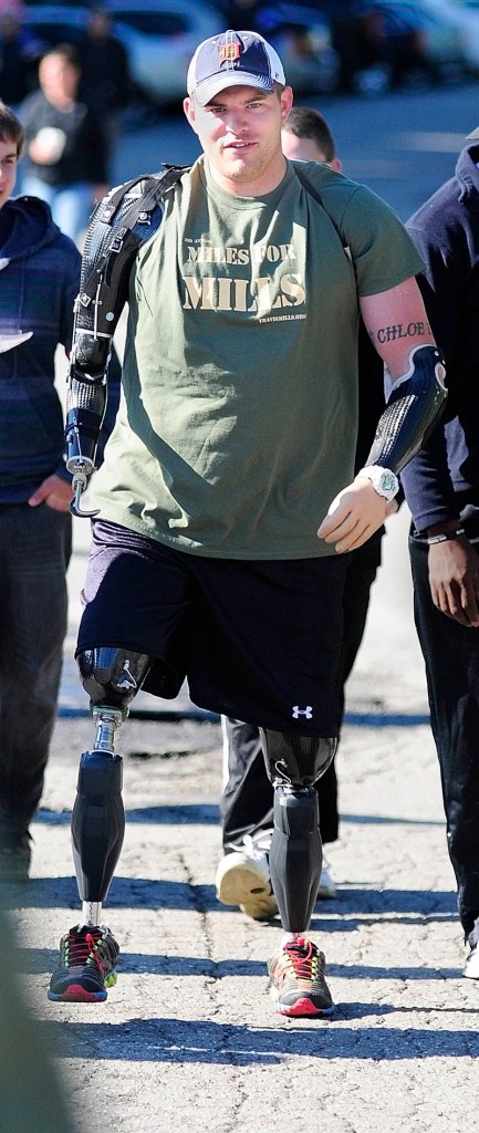 Staff Sgt. Travis Mills walks part of the course at the second annual Miles For Mills 5k on Monday at Cony High School in Augusta.