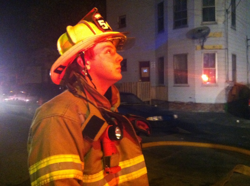 Nehemiah Chase of the Lisbon Falls Fire Department monitors ladder operations.