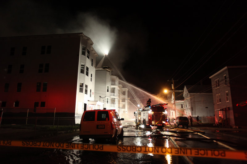 Three of the structures were owned by Phyllis St. Laurent, who said she didn't know who owned the condemned building.