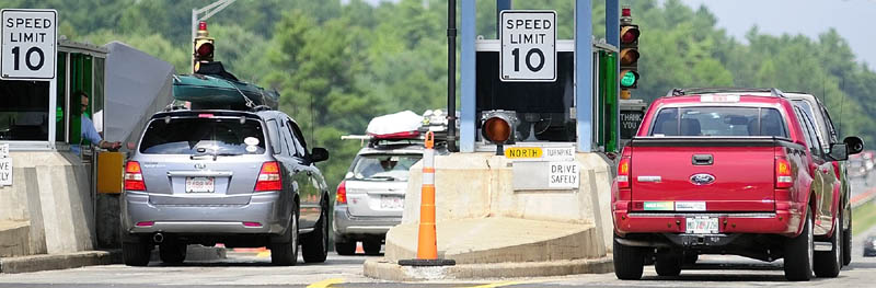 Vehicles pay tolls at the Mile 101 plaza on the Maine Turnpike (Interstate 95) in West Gardiner in this August 2012 file photo.