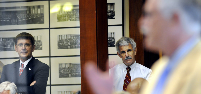 Sens. John Patrick, left, D-Rumford, and Roger Katz, R-Augusta, watch the debate in the House of Representatives Wednesday before the vote to override Gov. Paul LePage's veto of the state budget. Katz and House Minority Leader Kenneth Fredette loudly rebuked LePage's actions and leadership this week, in a sign that there's a growing divide in the Maine Republican Party.