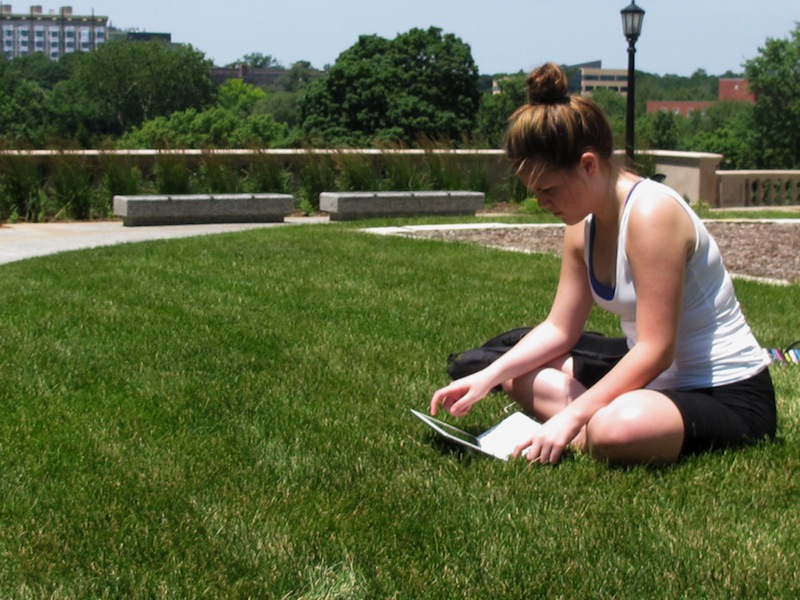 University of Iowa student Angie Platt, 20, is seen on campus in Iowa City, Iowa on Monday, July 1, 2013. College students taking out new loans for the fall term will see interest rates twice what they were in the spring — unless Congress fulfills its pledge to restore lower rates when it returns after the July 4 holiday. Platt said the increase in interest rates for subsidized Stafford loans will add to her debt load, which is expected to top $60,000 by the time she graduates. (AP Photo/Ryan J. Foley)