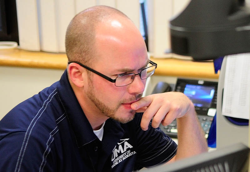 Jeremy Bouford, a 31-year-old biology major originally from Madison who now lives in Augusta, works in the advising office on Friday at the University of Maine at Augusta,