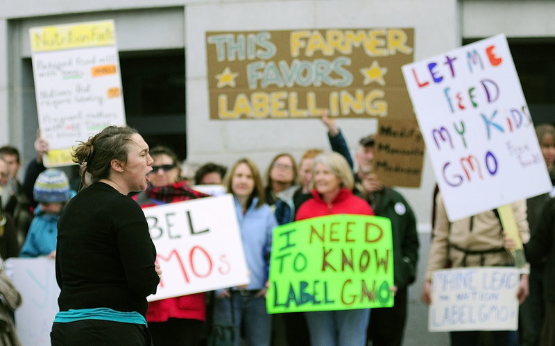 Logan Perkins, Right to Know-GMO Campaign Coordinator for Maine Organic Farmers and Gardeners Association, speaks at a rally outside the Maine State House on Tuesday April 23, 2013. Gov. LePage says he'll sign a bill that would require food producers to label products containing genetically modified ingredients.