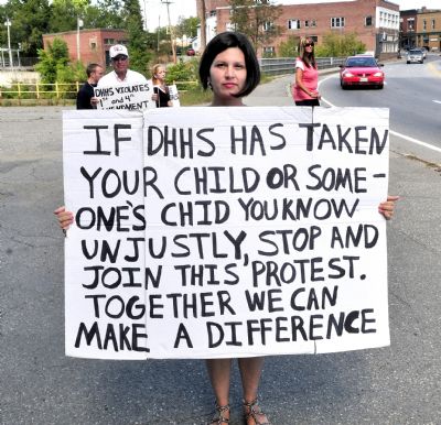 BethMarie Retamozzo protests against the state Department of Health and Human Services in Skowhegan on Aug. 31, 2012. Retamozzo, accused of abducting her children during a supervised visit on Thursday and captured in South Carolina on Saturday, was most recently judged unable to care for her children on Aug. 8 by probate Judge John Alsop, who wrote, "A child is at risk when his or her parent fails to recognize danger, denies obvious facts, lies to the court appointed guardian and is also willing to lie in court."