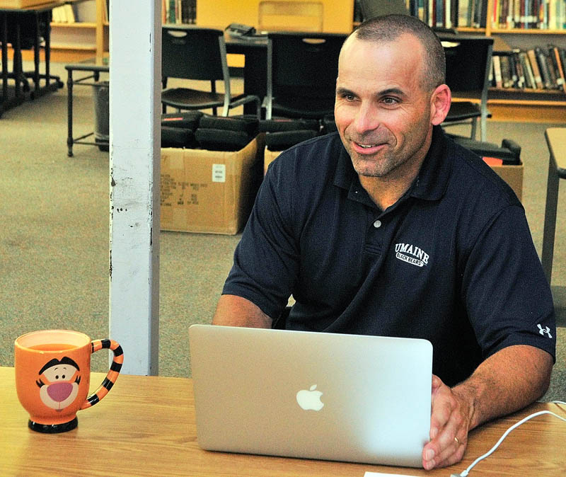 Gardiner Area High School Principal Chad Kempton works on his laptop in the library on Wednesday at Gardiner Area High School in Gardiner.