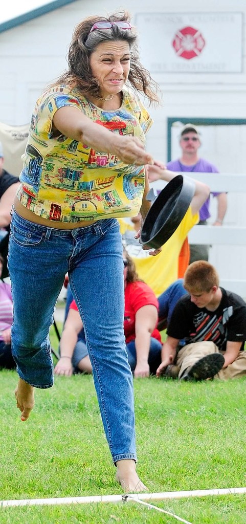 Jodi Lucas, 41, of Auburn, competes in the Ladies Fry Pan Throwing Contest today at the Windsor Fair.