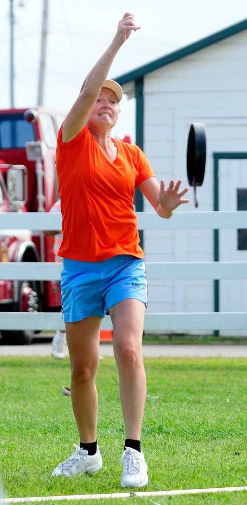 Ingrid Prikryl, 33, of Windsor, competes in the Ladies Fry Pan Throwing Contest today at the Windsor Fair. She won her age group and the overall grand championship by defeating other age-group winners.