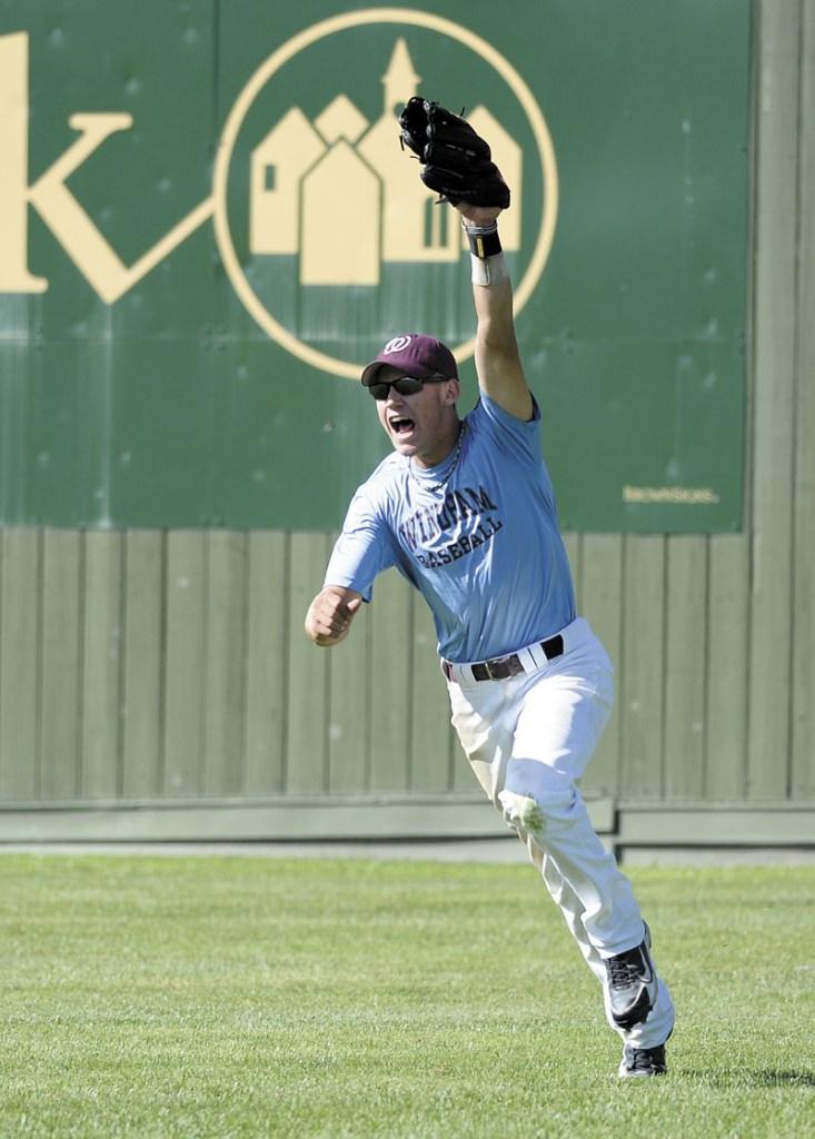 IT’S OVER: Calvin Field of Windham celebrates after catching the final out of the game in right field to secure the Merchants’ 9-1 win over Westbrook in the title game of the American Legion baseball state tournament Monday at Morton Field in Augusta.