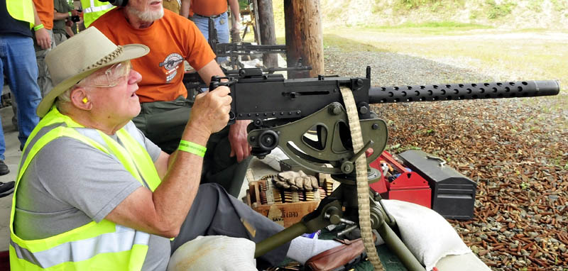 Veteran Roland Marquis, of Augusta, fires a machine gun during the Wounded Warriors Machine Gun Shoot in North Anson today.