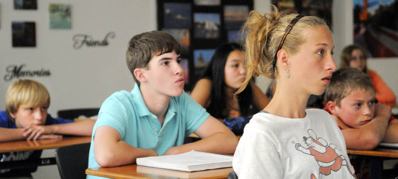 Cony High School freshmen watch a video Wednesday at the Augusta school about the 9/11 attacks on the twelfth anniversary.