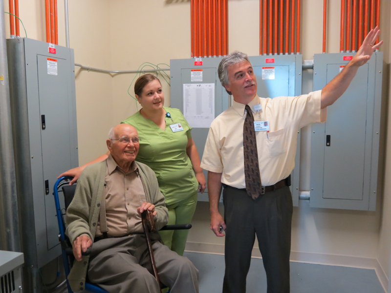 Harold “Bill” Armstrong, registered nurse Kirsten Mack and Rick Albert, MaineGeneral Health’s director of engineering and plant operations, check out some electrical panels in the new hospital in north Augusta that is set to open in November.