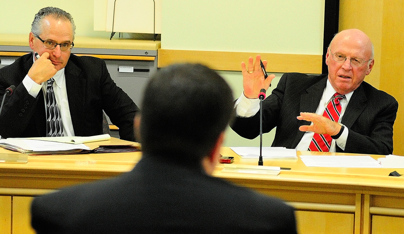 Commission member George Jabar, left, listens as Daniel Wathen, right, questions Gardiner City Manager Scott Morelli on Thursday during a meeting of the panel looking into unemployment reform in Augusta.