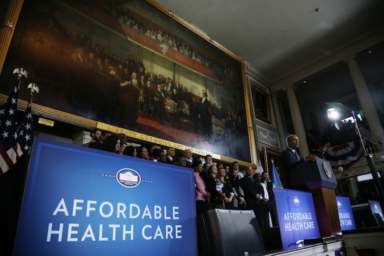 President Barack Obama speaks at Boston’s historic Faneuil Hall about the federal health care law, Wednesday, Oct. 30, 2013. Faneuil Hall is where former Massachusetts Gov. Mitt Romney, Obama’s rival in the 2012 presidential election, signed the state’s landmark health care law in 2006, with top Democrats standing by his side.