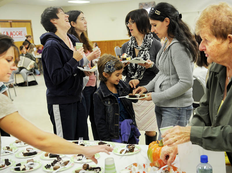 Guests at the Bread of Life Chocolate Festival Sunday in Augusta consume sweets at the Kennebec Chocolates table. Money from donated chocolate and silent auction items will offset costs at Bread of Life, which operates a food kitchen, homeless shelter and veterans shelter in Augusta.