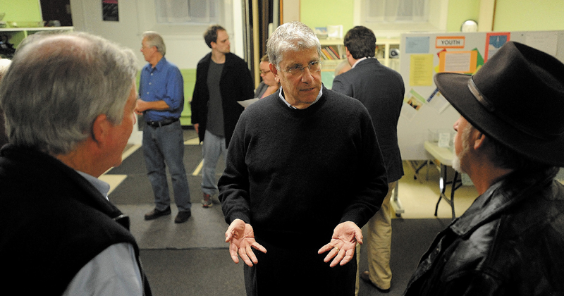 Eliot Cutler, center, speaks with local voters during a gubernatorial campaign visit at the Universalist Unitarian Church in Waterville on Wednesday night.