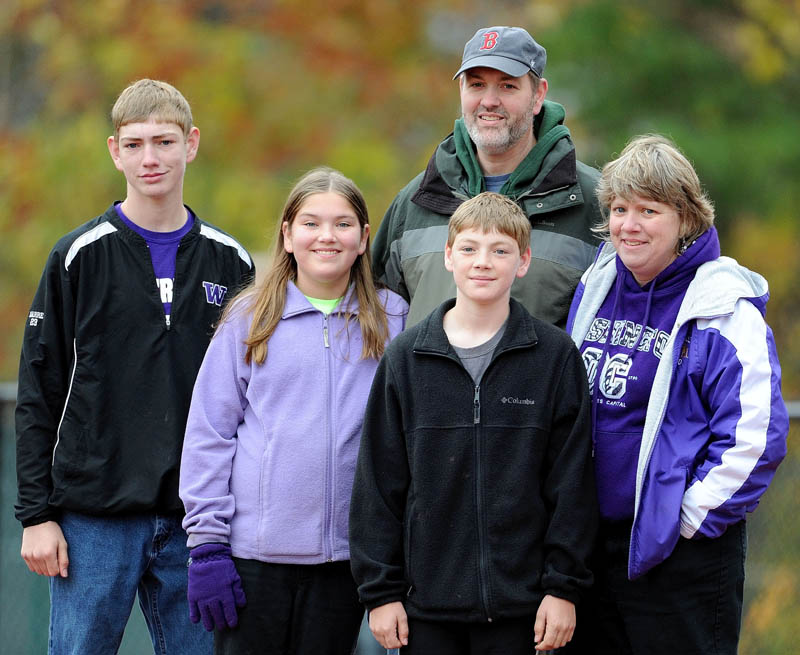 Greg and Sue Barre with their children, from left, Adam, Sarah and David, are all life-long Boston Red Sox fans, but they've had very different experiences growing up with baseball. While the parents watched the Red Sox lose year after year, their children are accustomed to World Series appearances.