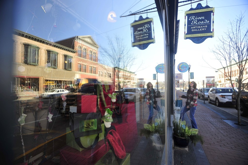 Local merchant: A shopper enters the River Roads Artisans Gallery on Saturday on Water Street in downtown Skowhegan. Saturday was Small Business Saturday, during which local stores offer special holiday deals.