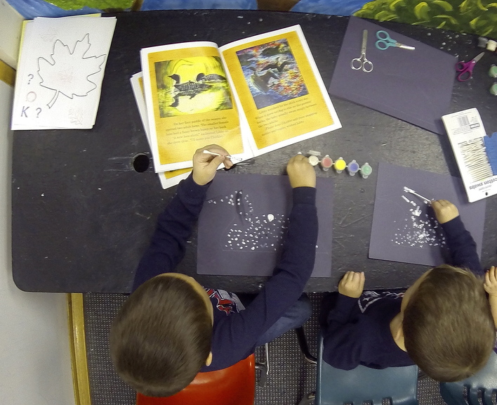 Riveted: Keaton Gregoire, 6, left, and Isaac Gregoire, 4, both of Greene, do an art project after hearing Nancy Prince read her book “Libby’s Loons” on Saturday at Children’s Discovery Museum in Augusta.